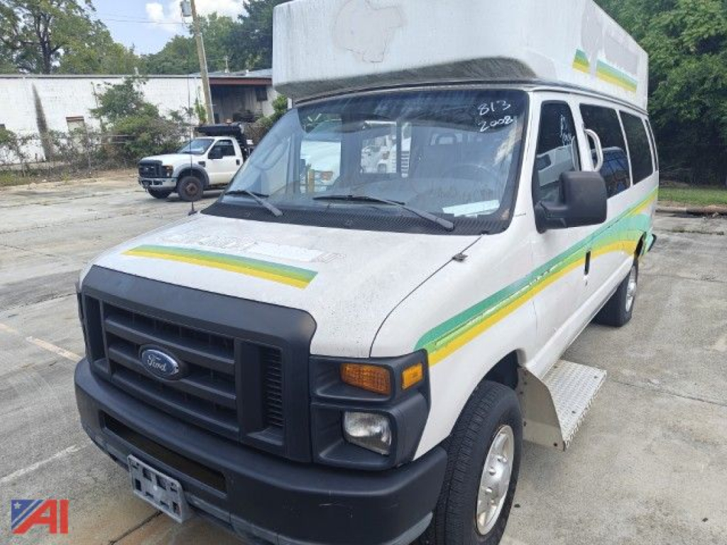 Ford E-350 passenger van (2008) in-service with white exterior and green-yellow stripe graphics, side entry door, front grille, and high-top roof.