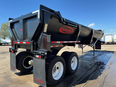 Dura Haul rock tub frameless end dump trailer in black with red logo showing dual rear axles and off-ground stance.