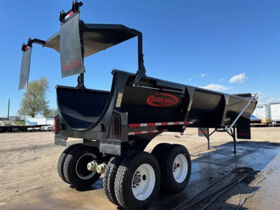 Dura Haul rock tub frameless end dump trailer showing dual rear axles with white wheels and black tub, with red Dura-Haul logo on side.