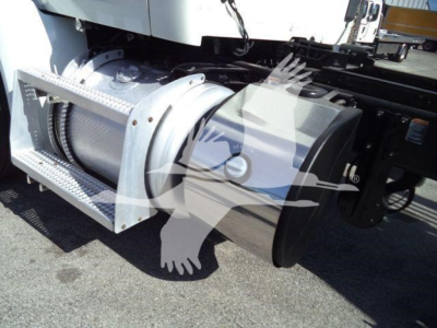 Peterbilt 567 rollback truck showing drivetrain component and side air intake with metal step.