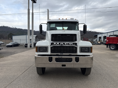 Front view of a Mack PI64T truck showing bold grille with MACK logo, large bumper, and dual headlights.