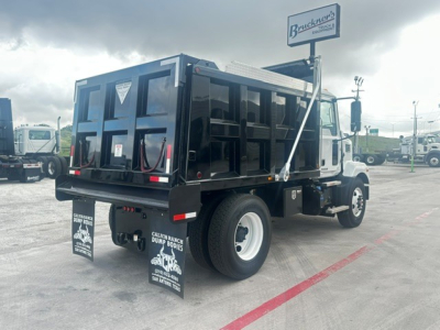 Dump truck rear and side view showing cargo bed and mud flaps.