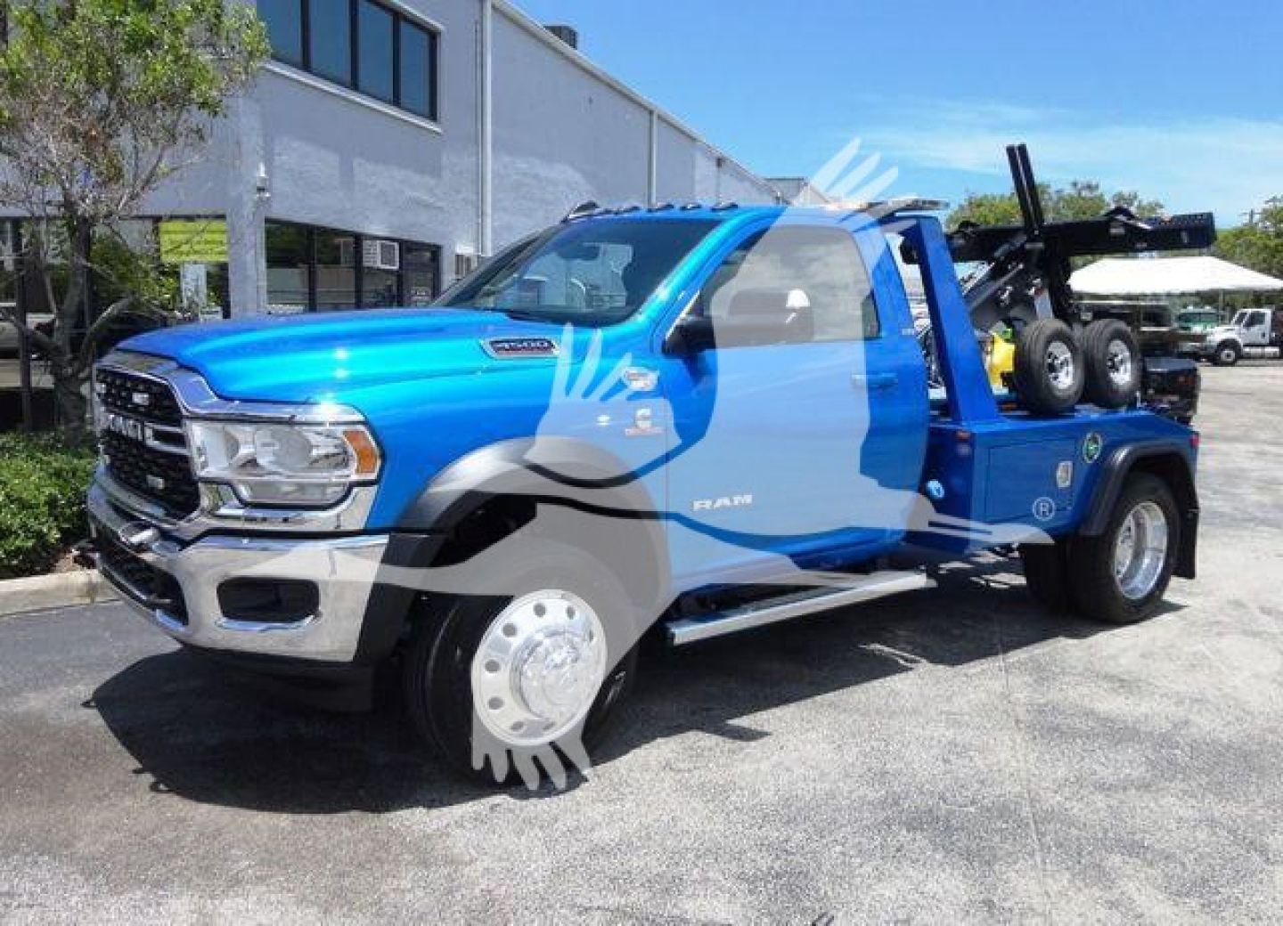 Ram 4500 truck in blue with front grille and winch equipment showing stock image details