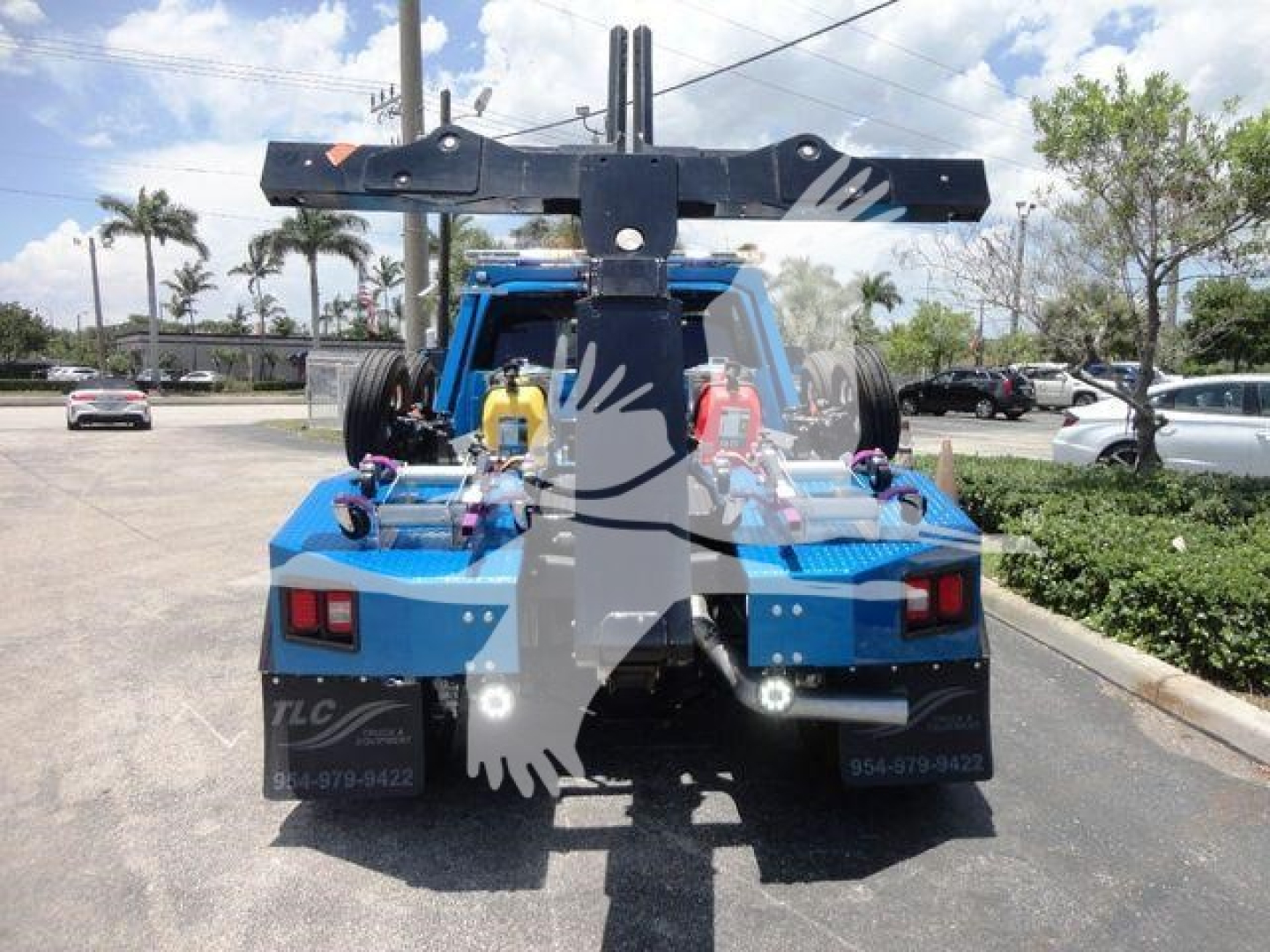 Ram 4500 tow truck rear view showing winch mounting and hydraulic components with blue chassis.