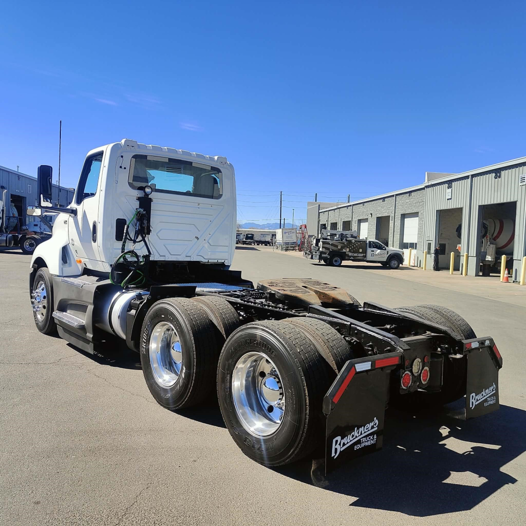 International LT daycab truck chassis showing rear view with dual rear axles and sixth-wheel configuration.