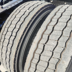 Wheel and tire close-up view on a 2021 International LT truck, showing dual rear tires with tread pattern and inner wheel rim.
