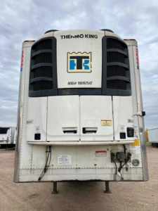 Thermo King refrigerated trailer front view showing Thermo King logo and ARB#19917547 with black cooling fans on sides and a central white panel.