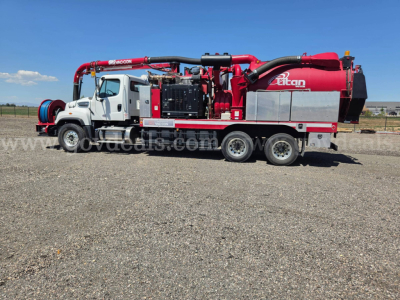 Vacuum truck side profile showing Lexan water tank and Titan nozzle equipment mounted on Freightliner 114SD chassis with multiple red hoses and compartments.
