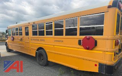 Bus CE Series school bus side rear view with yellow body and black windows, 'SCHOOL' markings and red rear hazard warning cap visible