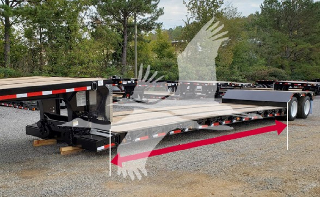 Fontaine Renegade trailer in a yard showing a double drop expandable setup with flatbed deck and support frame, no visible branding text.