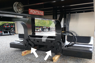 Fontaine Renegade trailer chassis with double drop configuration, showing hydraulic hoses and coupler area, and a Fontaine logo plate