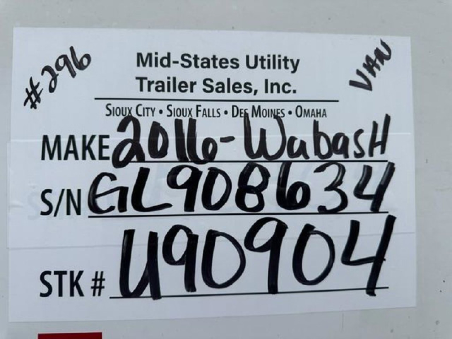 Trailer label with handwritten VIN and stock number from Mid-Sates Utility Trailer Sales, Inc. Make 2016 Wabash; S/N GL9086634; STK U90904; VAW mark.