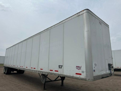 Trailer: 53' Wabash van trailer viewed from side/front, white exterior with support legs and rear doors visible.