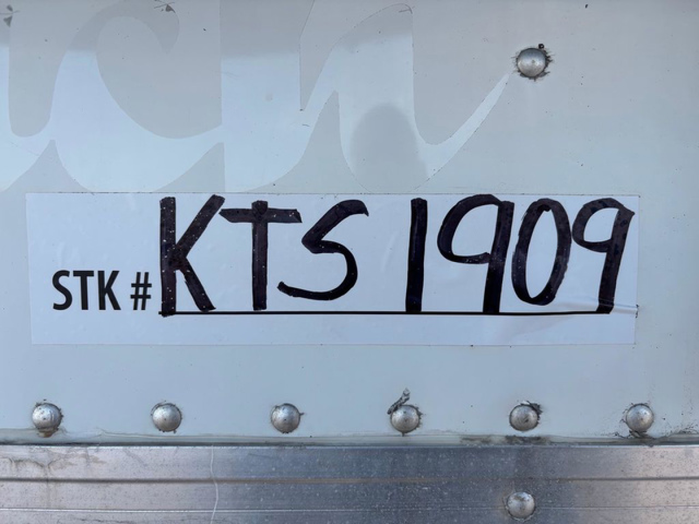 Stock tag showing STK # KTS1909 and large handwritten KTS1909 on plate.