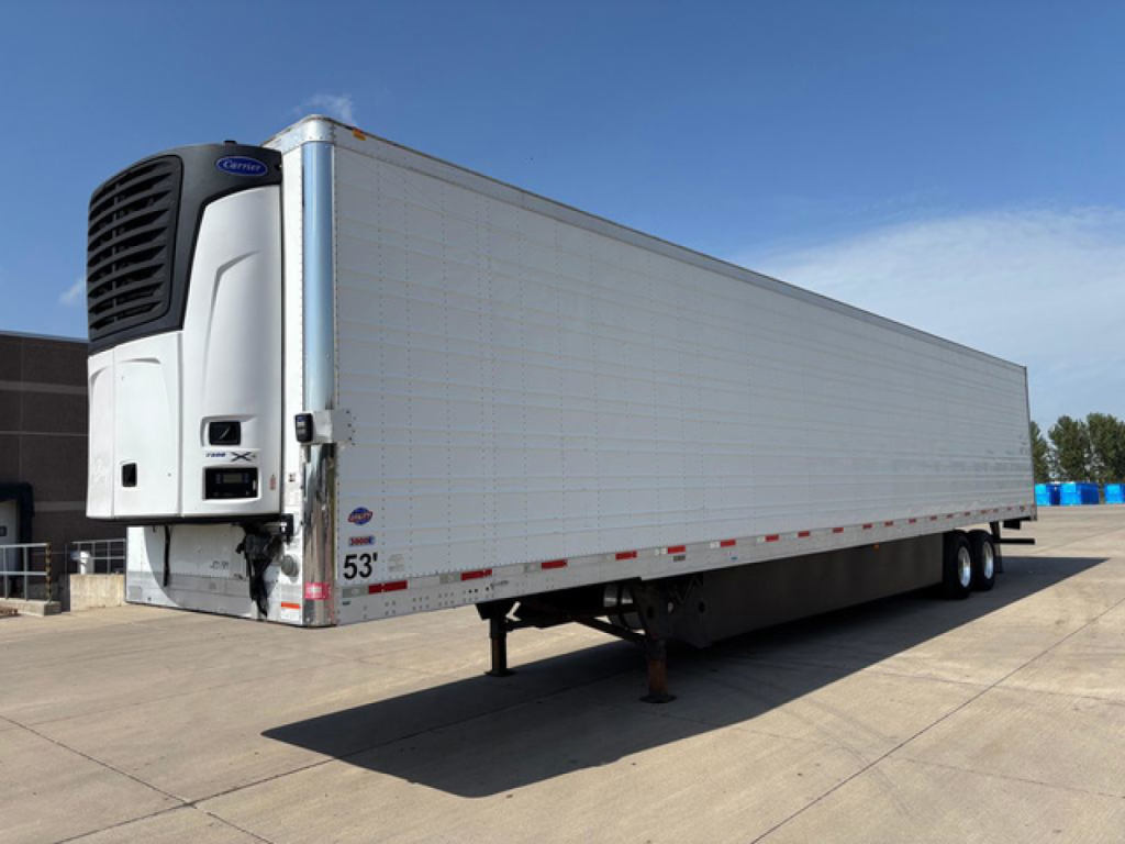 Utility refrigerated trailer with a front refrigeration unit and raised landing gear. Side shows long white panel with small red reflectors along the bottom edge.