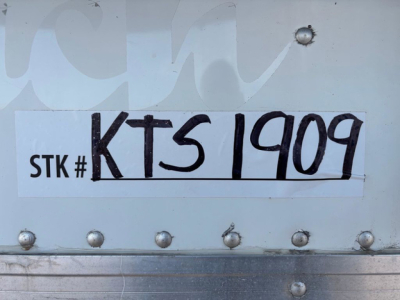 Stock tag showing STK # KTS1909 and large handwritten KTS1909 on plate.