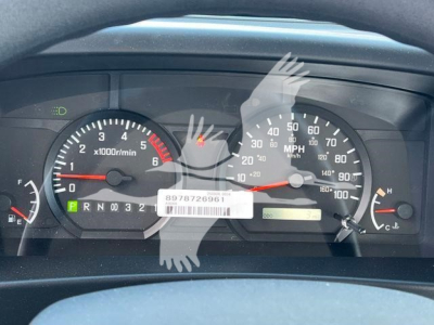 Dashboard of a 2026 Isuzu NRR showing speedometer, tachometer, gear selector PRND, and warning lights.