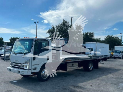 Isuzu NPR/RR tow truck with rollback bed and crane, front grille, cab in view.