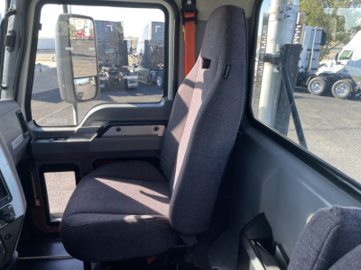 Mack AN64T truck cab interior showing front passenger seat and side window with door frame