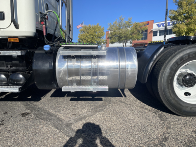 Truck fuel tank and side view of Mack AN64T cab and dual rear axles with chrome fuel tank and wheel.