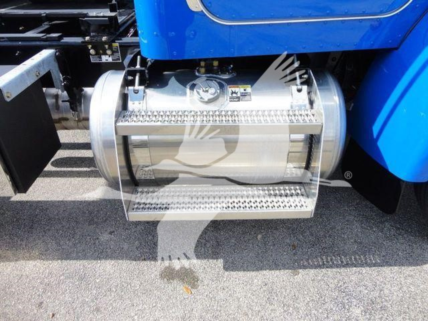 Peterbilt 337 side fuel tank and steps under blue cab, metal cylindrical tank with diamond plate steps and caps visible