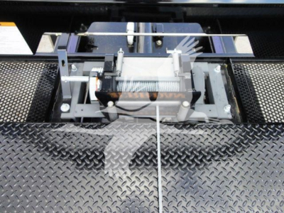 Trucks equipment mount showing a wheel-lift or hoist assembly on a diamond plate surface.
