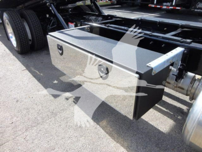 Peterbilt 337 rollback truck chassis side toolbox with diamond plate finish mounted under the cab; square metal toolbox with handle and lock.