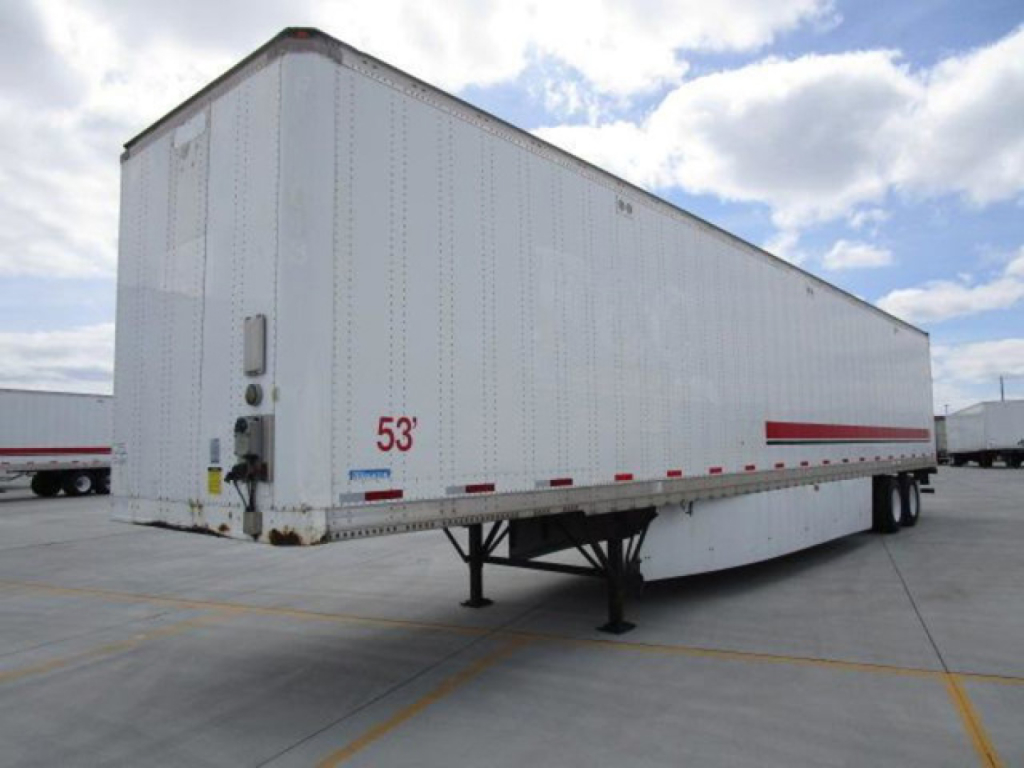 Stoughton 53' dry van trailer from left rear angle showing landing gear, front nose, red 53' marking and stock number plate.
