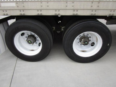 Dual trailer tires on a 2014 Stoughton Van showing wheels and suspension