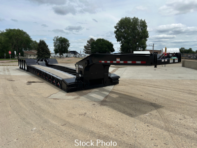 Load King 554-Quad-9' Wide 24' LDH trailer in stock photo showing lowboy platform and gooseneck, with VIN 5LKL57457V1036008 and stock 72999.