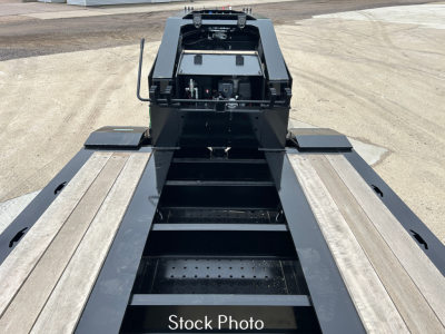Lowboy trailer bed with central frame and access steps; visible labels not legible.