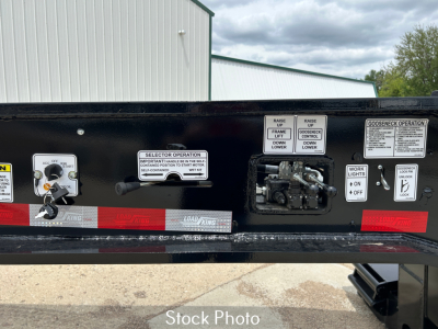 Load King trailer control panel area with labels and levers showing operational instructions and gauges.