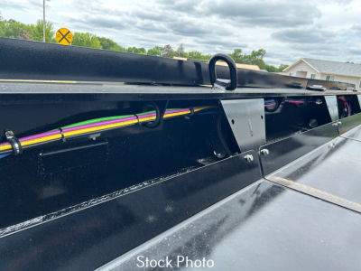 Load King trailer side rail showing electrical wiring harness and bracket with stock photo label.