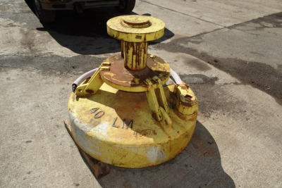 Rear view of a yellow Walker 40LM mooring or load handling component with rust and wear showing '40 LM' on the base.