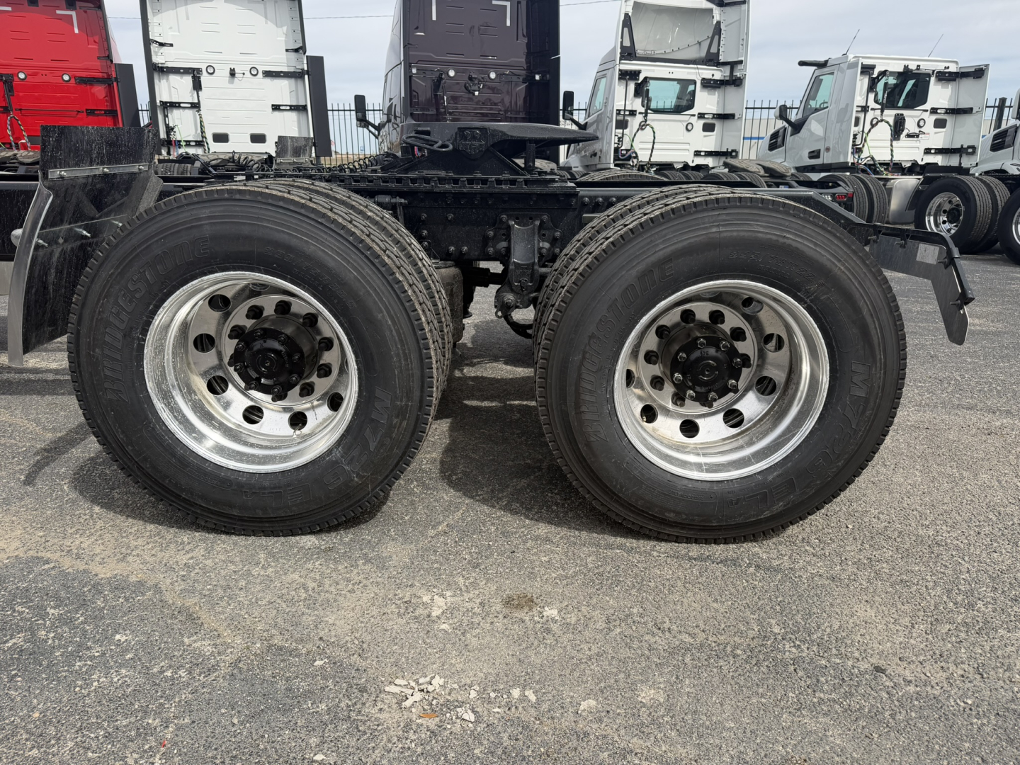Twin rear axles of a Mack AN64T truck chassis showing dual wheels and suspension components.