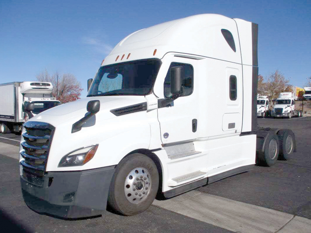 Truck cab: 2022 Freightliner Cascadia126 sleeper with white exterior, side mirrors, aerodynamic fairings, and dual rear axles. VIN and stock number not visible on text in image.