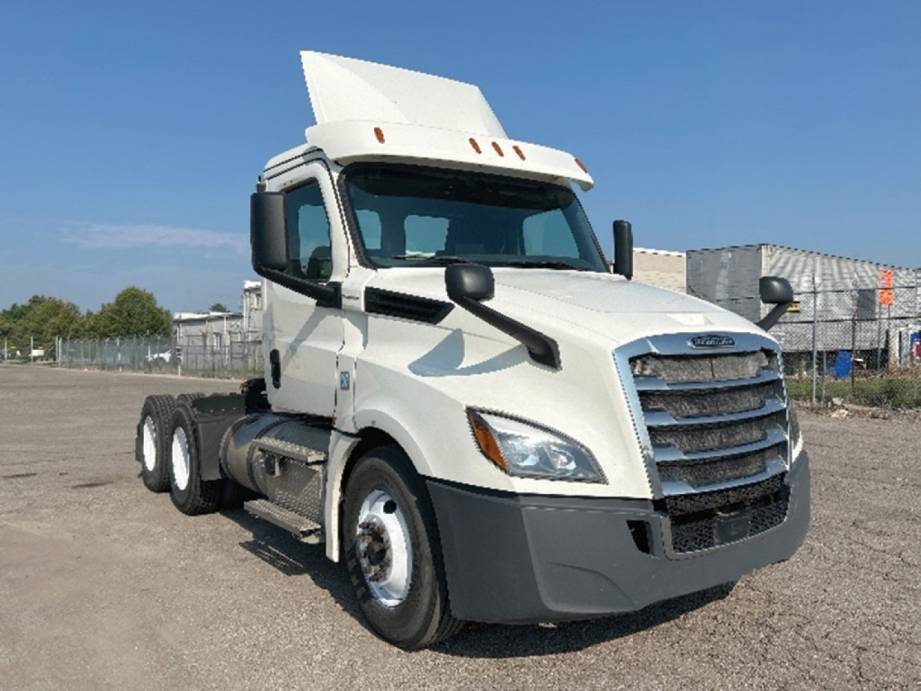 Freightliner Cascadia126 tractor unit from a front-left angle; no visible text on truck except general truck features.