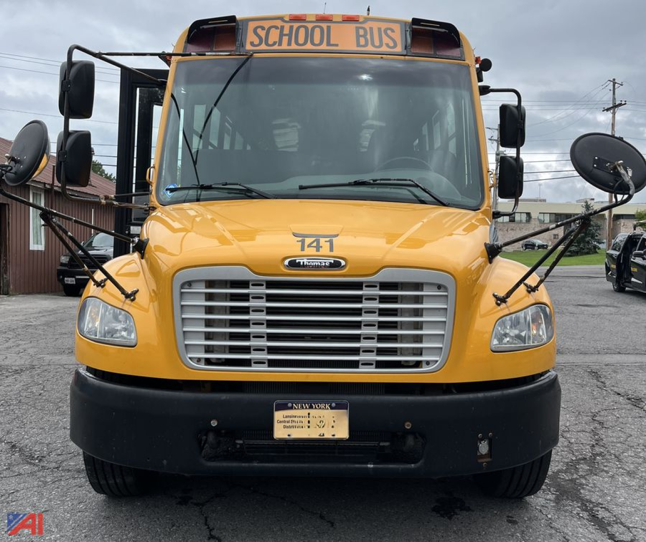 Front view of a yellow 2017 Freightliner Thomas B2B/C2 school bus showing front grille, headlights, windshield, and side mirrors.