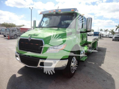 Truck cab in green with white accents and Cobra branding, MV607STEPSIDEFM stock photo.