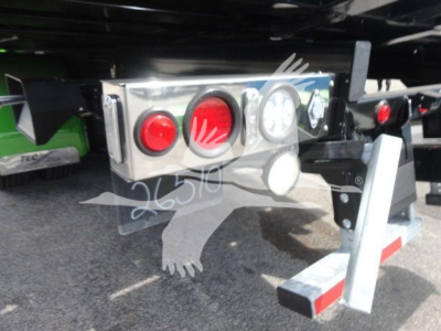 Trailer rear with taillights and bumper, metal housing with red and white lights; stamped numbers 26510 on silver panel.