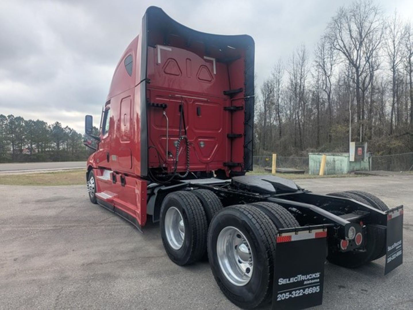 Freightliner Cascadia 126 truck cab and rear chassis view showing tandem axles and fifth wheel area.