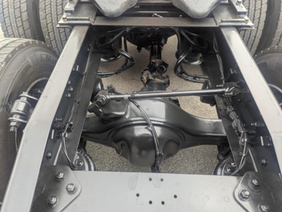 Freightliner Cascadia 126 chassis undercarriage showing rear axle, suspension, and frame rails.
