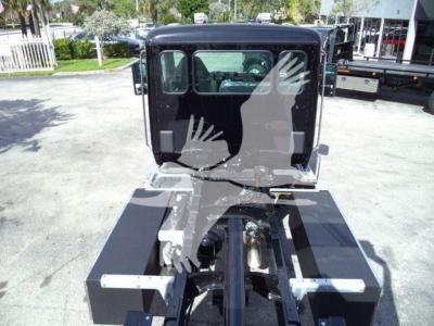 Kenworth T280 rollback truck chassis rear view showing frame and cab mounting area.