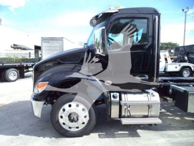 Kenworth T280 roll-back truck, side view showing cab, front wheel, fuel tank, and steps with chrome mirrors.