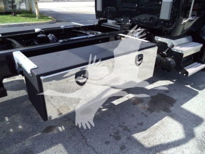 Storage toolbox mounted behind Kenworth T280 cab with dual latches and welded metal box.