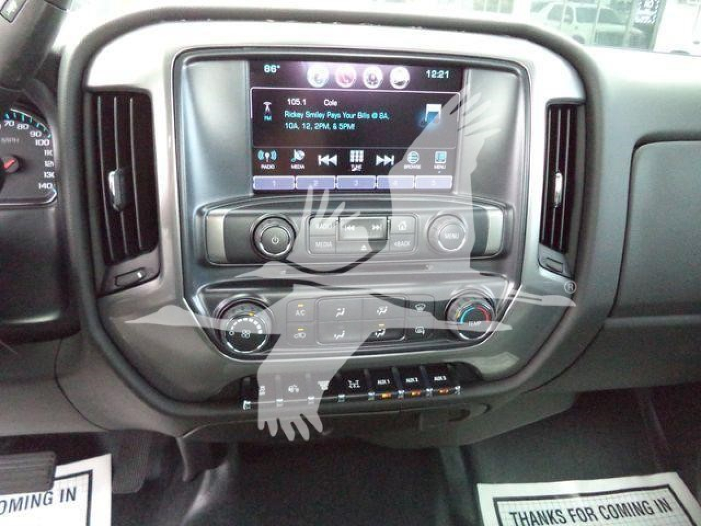 Dashboard of a 2023 Chevrolet Silverado 6500HD showing central touchscreen display with climate controls and buttons.