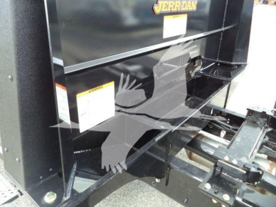 Truck equipment bay showing Jerr-Dan labeling and internal mounting area.