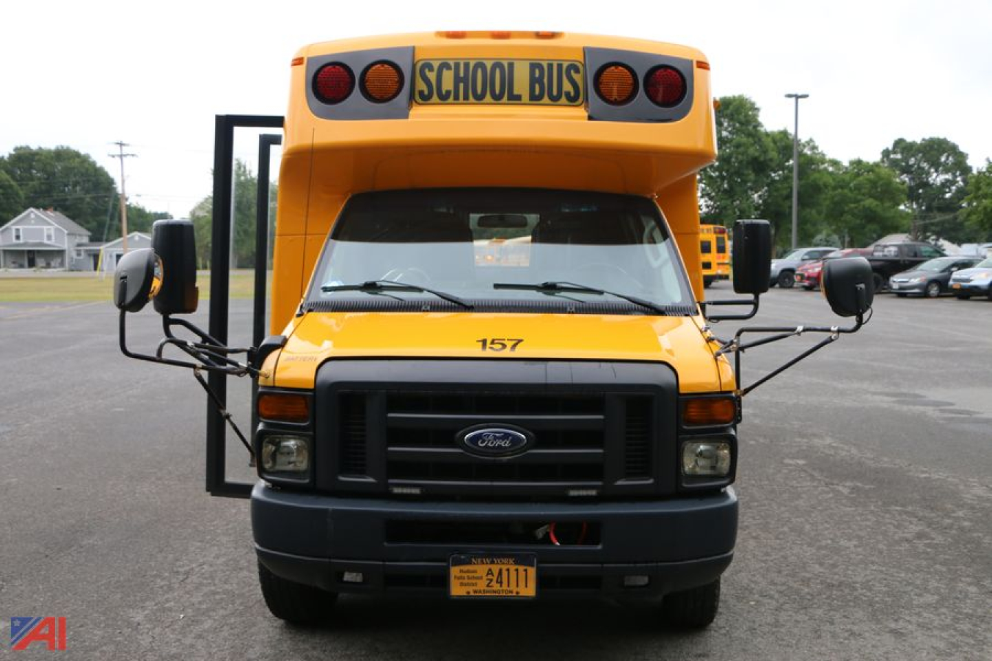 Ford E450 school bus front view with wheelchair lift and yellow exterior