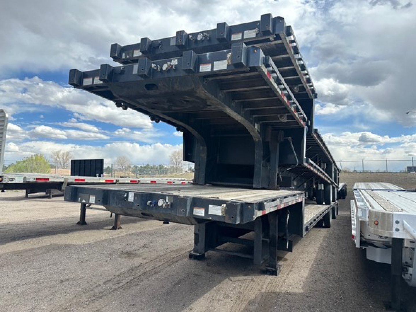 Great Dane steel spread air drop deck trailer showing drop deck structure and loading platform.