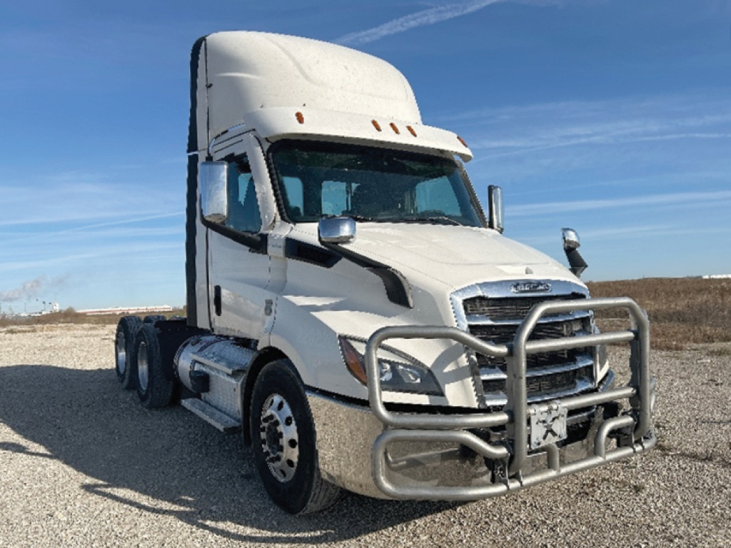 Freightliner Cascadia126 tractor cab front-left view showing chrome grille guard and high roof. Vehicle includes dual rear axles, white paint, and DOT-style mirrors.